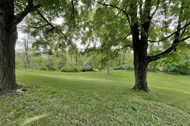 a view of outdoor space with deck and yard