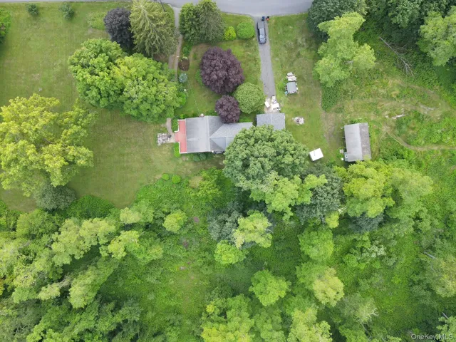 an aerial view of a house with pool yard outdoor seating and yard