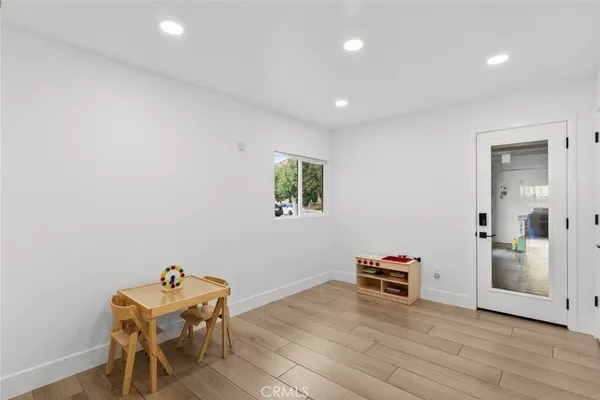 a room with furniture and wooden floor