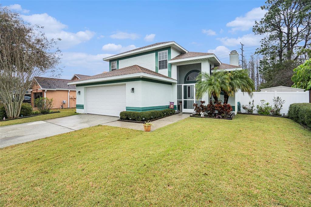 a front view of a house with swimming pool having outdoor seating