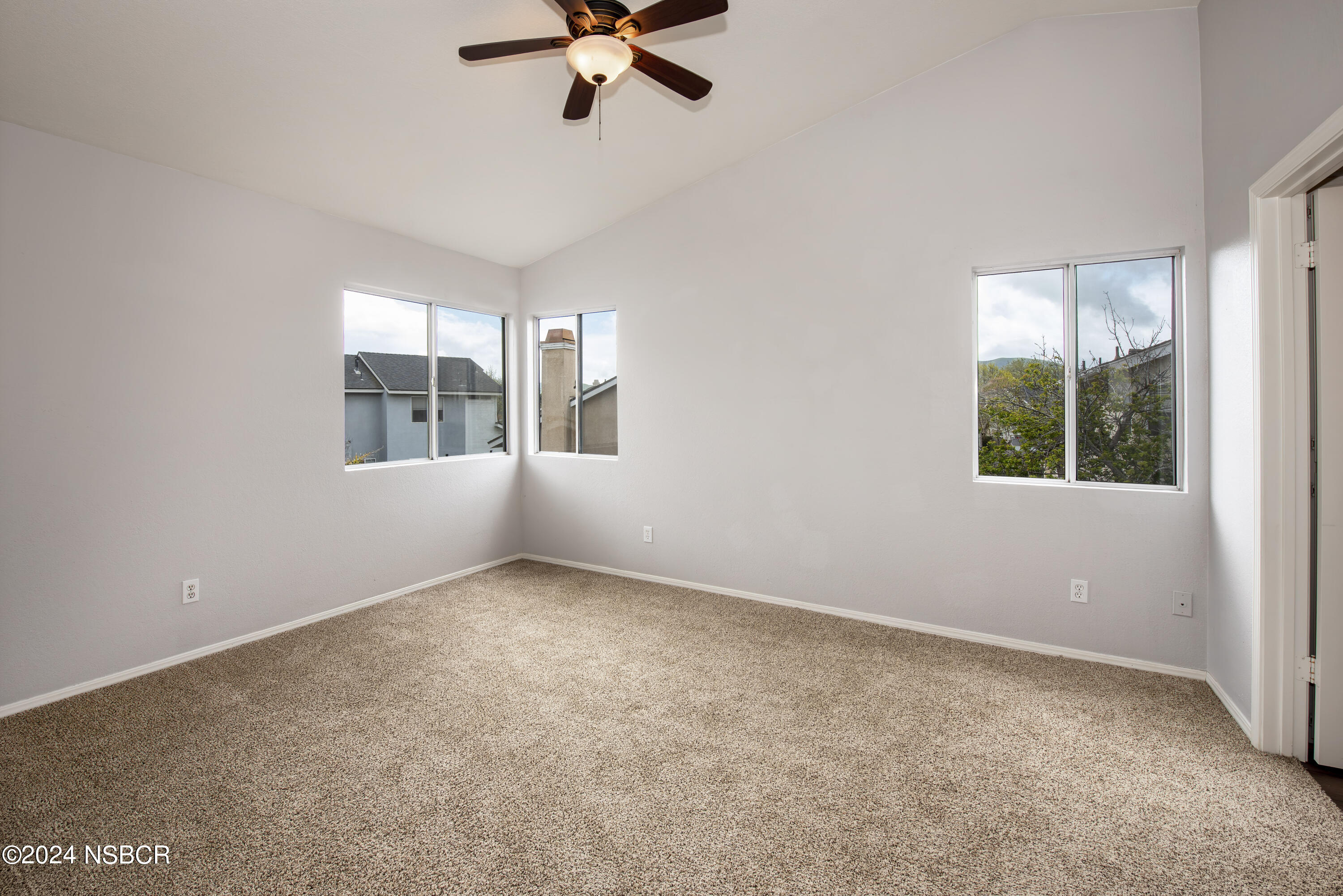 1341 Lloyd Place Lompoc, CA 93436 - Photo 12 of 20 an empty room with windows and fan