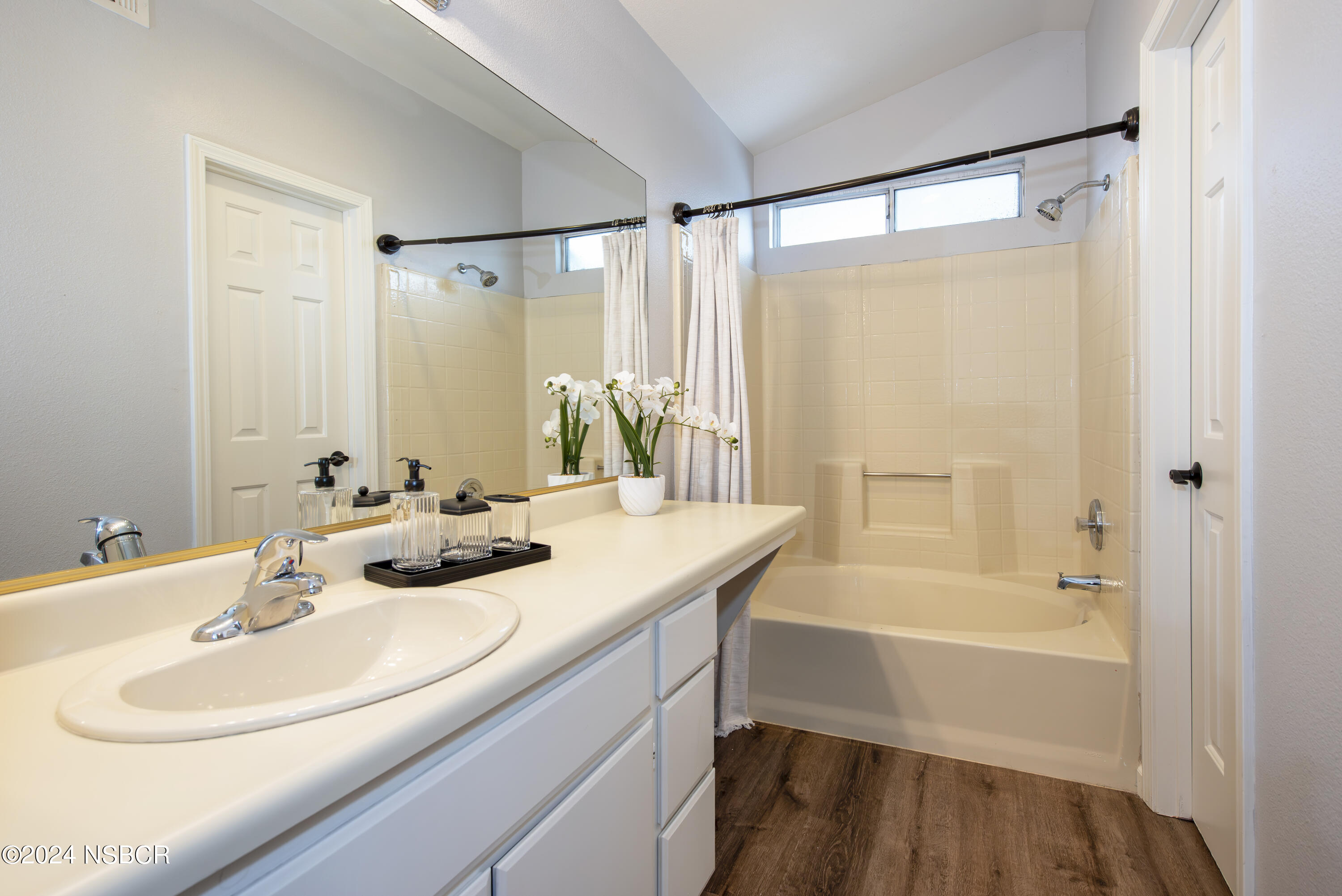 1341 Lloyd Place Lompoc, CA 93436 - Photo 14 of 20 a bathroom with a sink and a mirror