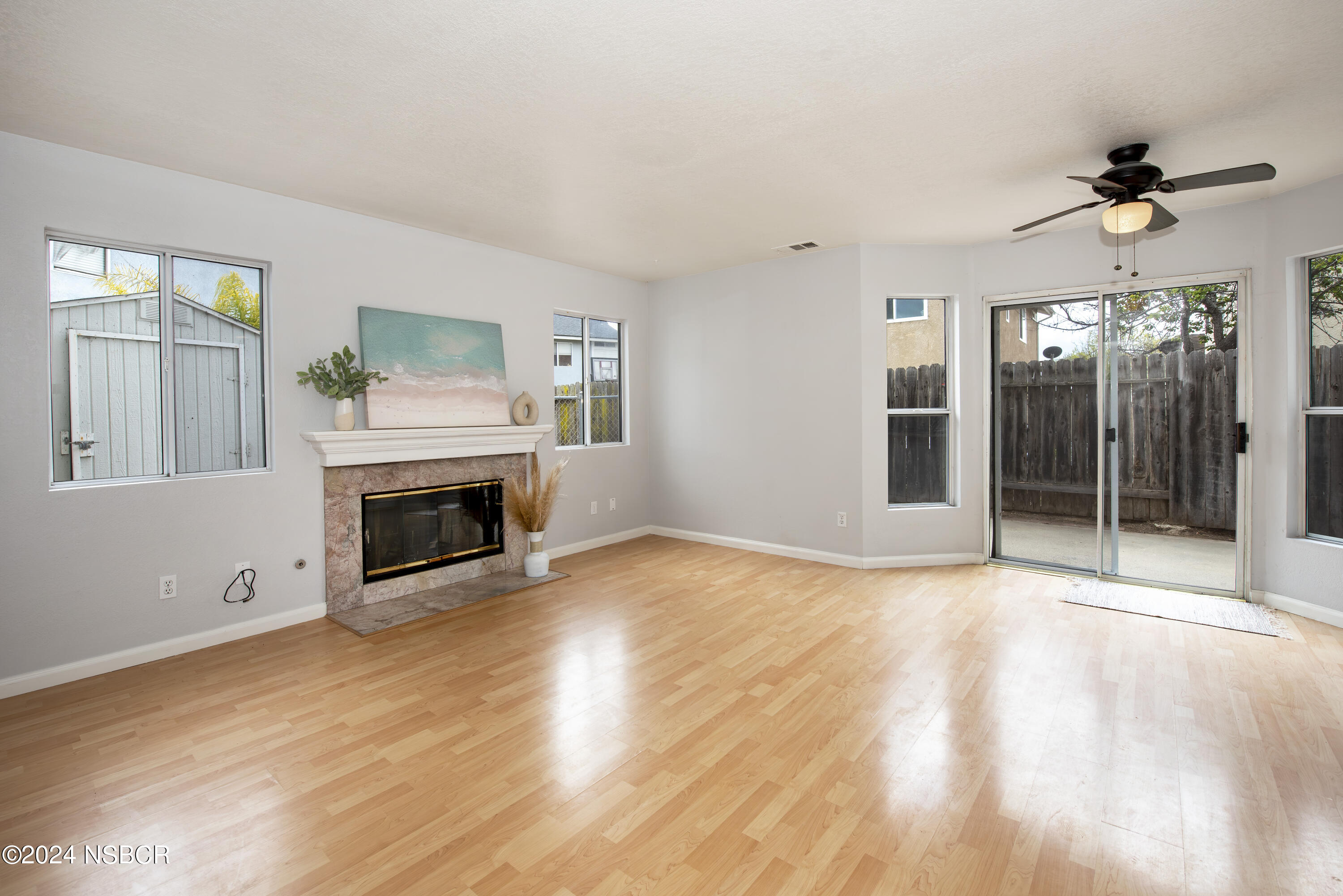 1341 Lloyd Place Lompoc, CA 93436 - Photo 6 of 20 a view of a livingroom with a fireplace and window