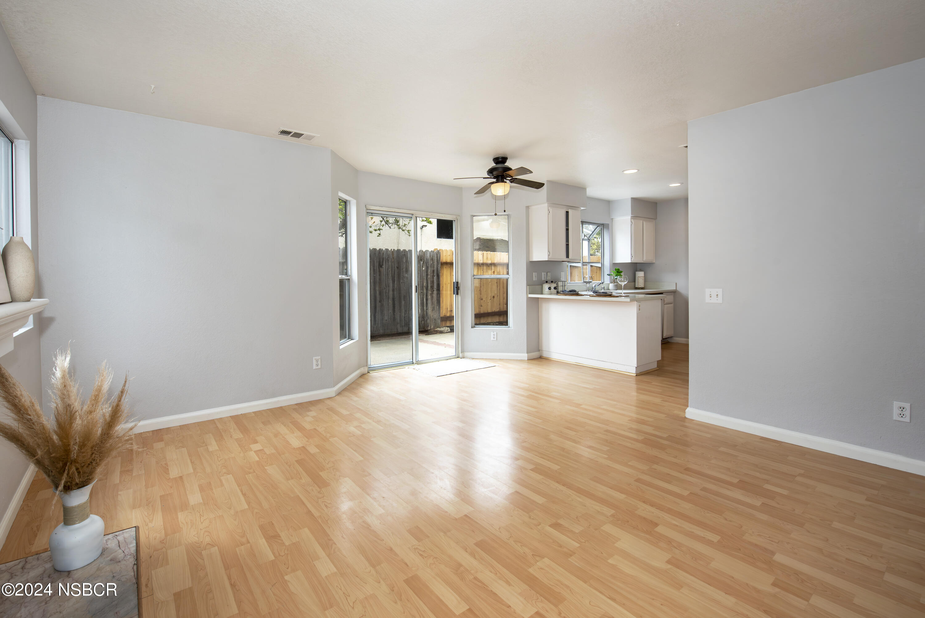 1341 Lloyd Place Lompoc, CA 93436 - Photo 7 of 20 a view of a kitchen with a sink and a refrigerator