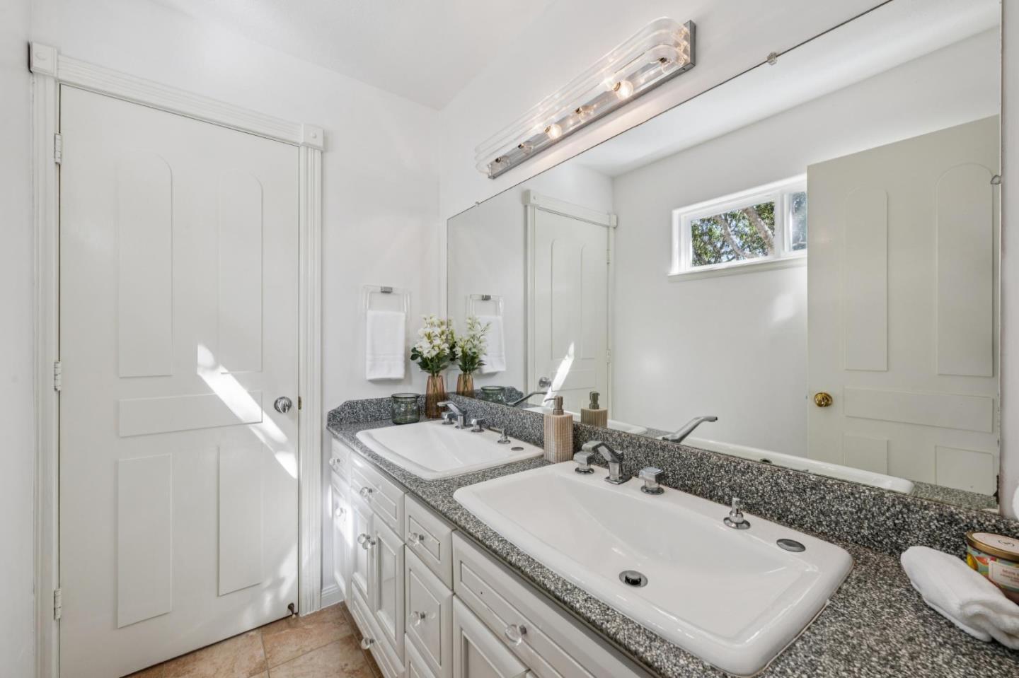 2905 Bird Rock Road Pebble Beach, CA 93953 - Photo 26 of 33 a bathroom with a sink and a mirror