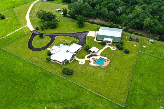an aerial view of a house having patio