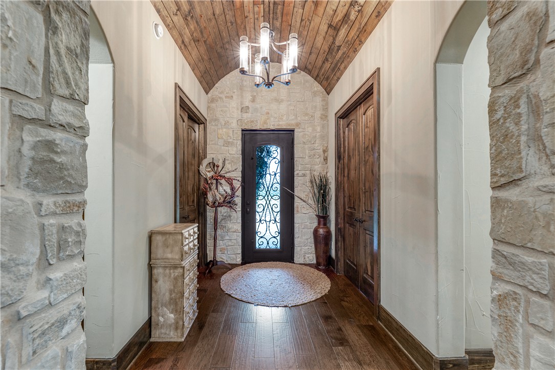 10285 Ferrill Creek Road Bryan, TX 77808 - Photo 17 of 49 a bathroom with a granite countertop toilet a mirror and shower curtain