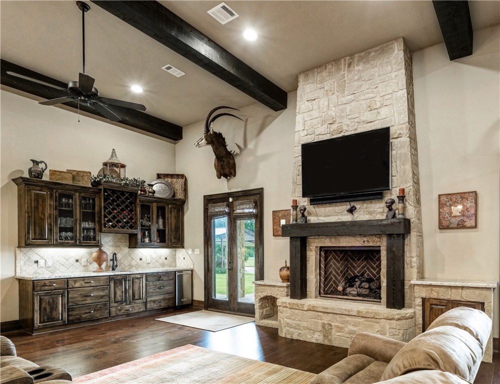 10285 Ferrill Creek Road Bryan, TX 77808 - Photo 23 of 49 a living room with furniture and a flat screen tv