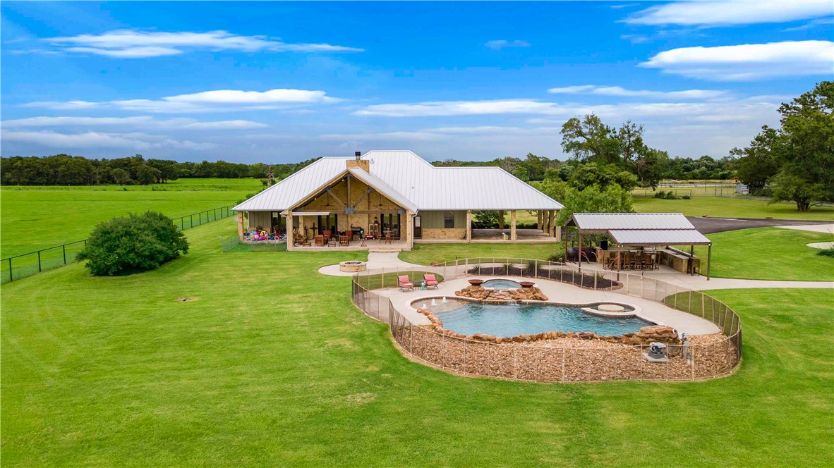 10285 Ferrill Creek Road Bryan, TX 77808 - Photo 4 of 49 a aerial view of a house with swimming pool and big yard