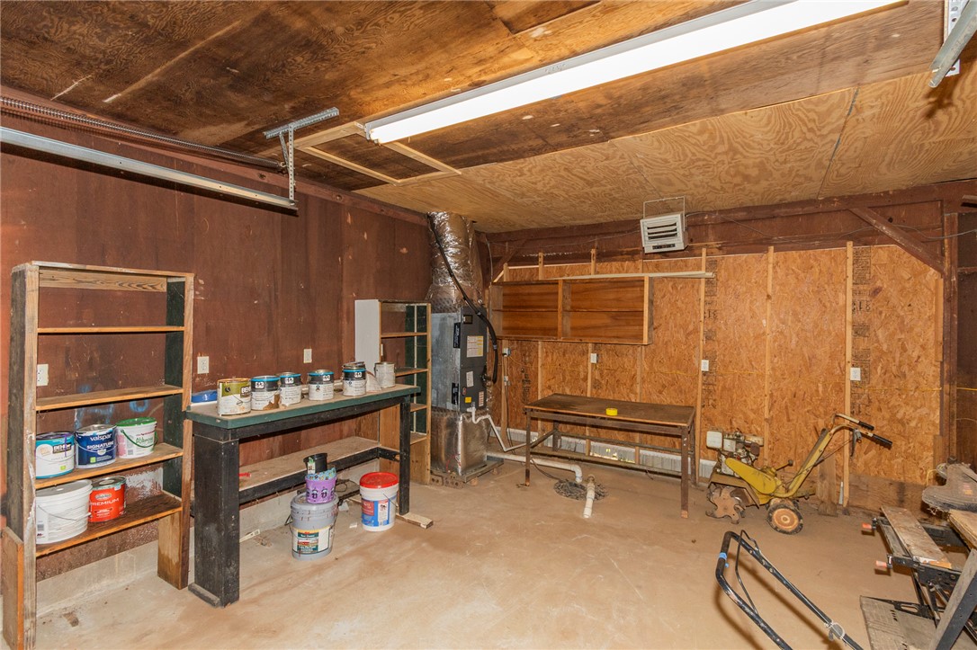 1116 Leatherdale Road Iva, SC 29655 - Photo 22 of 46 This functional garage offers ample space for vehicles and storage, perfect for any homeowner's needs.
