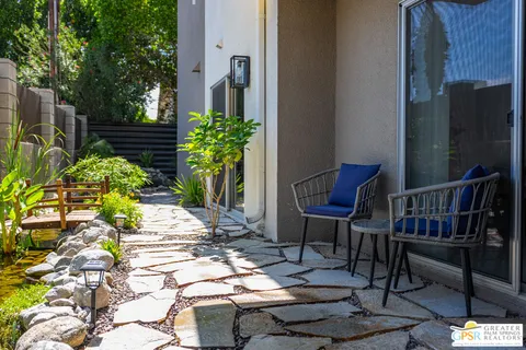 a front view of house with outdoor seating