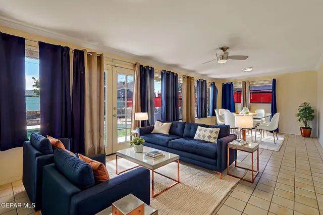 a living room with furniture and a large window