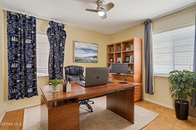 a view of a workspace with furniture