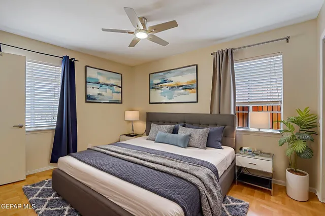 a bedroom with bed and a window