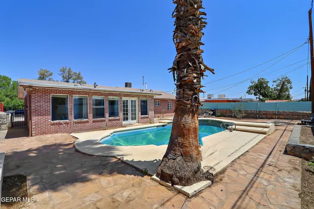 a front view of a house with a yard balcony