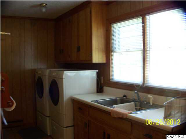 51 Repton Mill Road Aroda, VA 22709 - Photo 32 of 36 a kitchen with a sink cabinets and a window