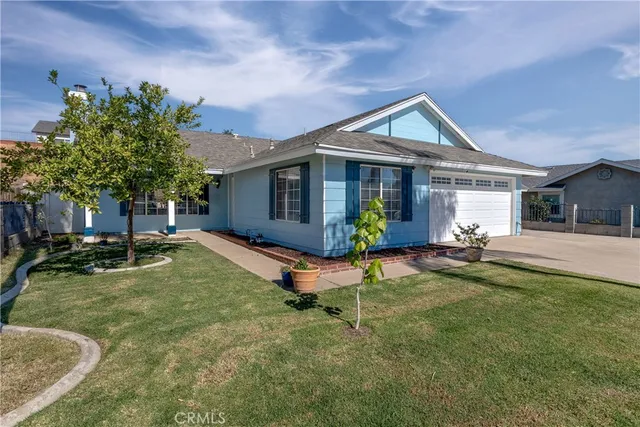 a view of a house with swimming pool and sitting area