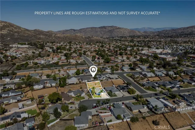 an aerial view of residential house and green space