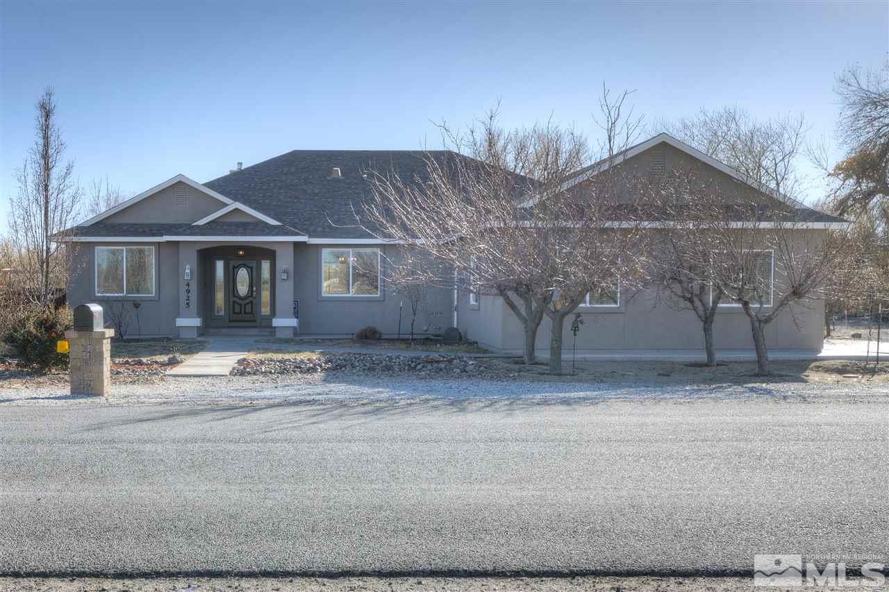 4925 Rancheria Road Fallon, NV 89406 - Photo 1 of 39 a front view of a house with a yard