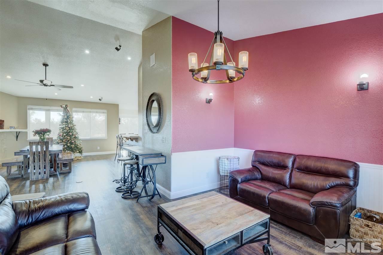 4925 Rancheria Road Fallon, NV 89406 - Photo 12 of 39 a living room with furniture a chandelier and a window