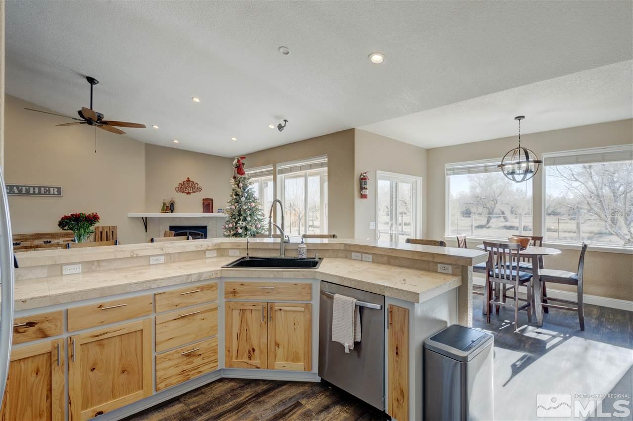 4925 Rancheria Road Fallon, NV 89406 - Photo 17 of 39 a open kitchen with sink cabinets and dining table
