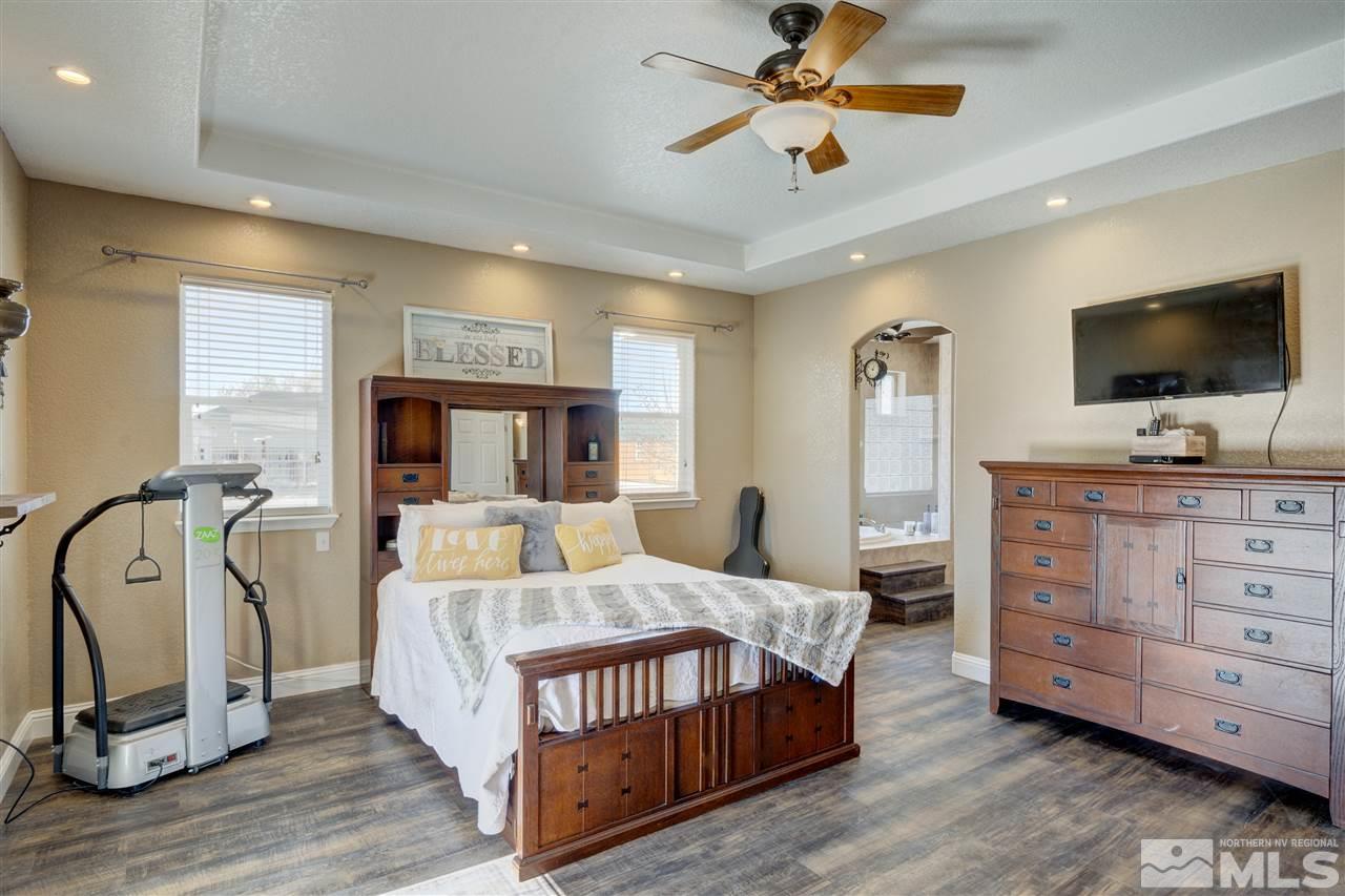 4925 Rancheria Road Fallon, NV 89406 - Photo 20 of 39 a bedroom with a bed and a flat screen tv