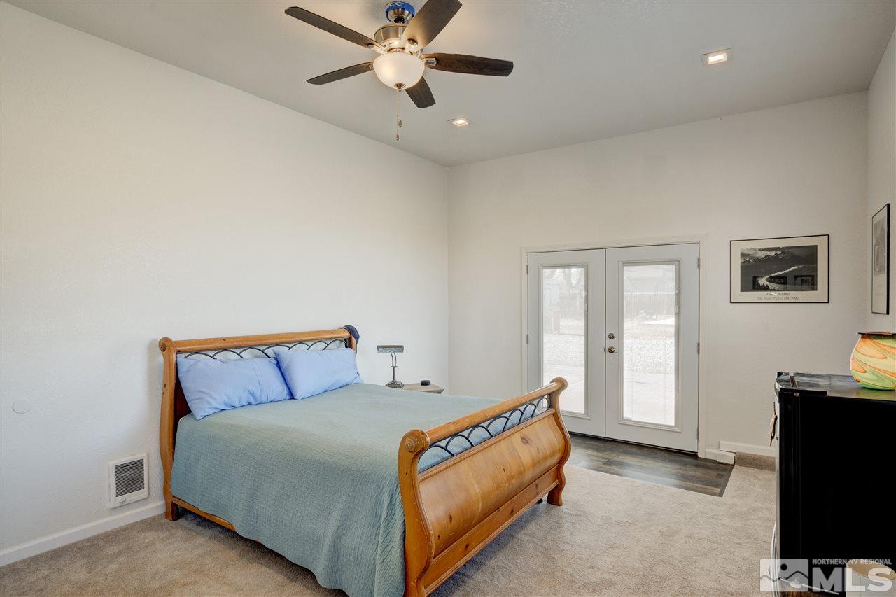 4925 Rancheria Road Fallon, NV 89406 - Photo 29 of 39 a bedroom with a bed and a flat tv screen on the dresser