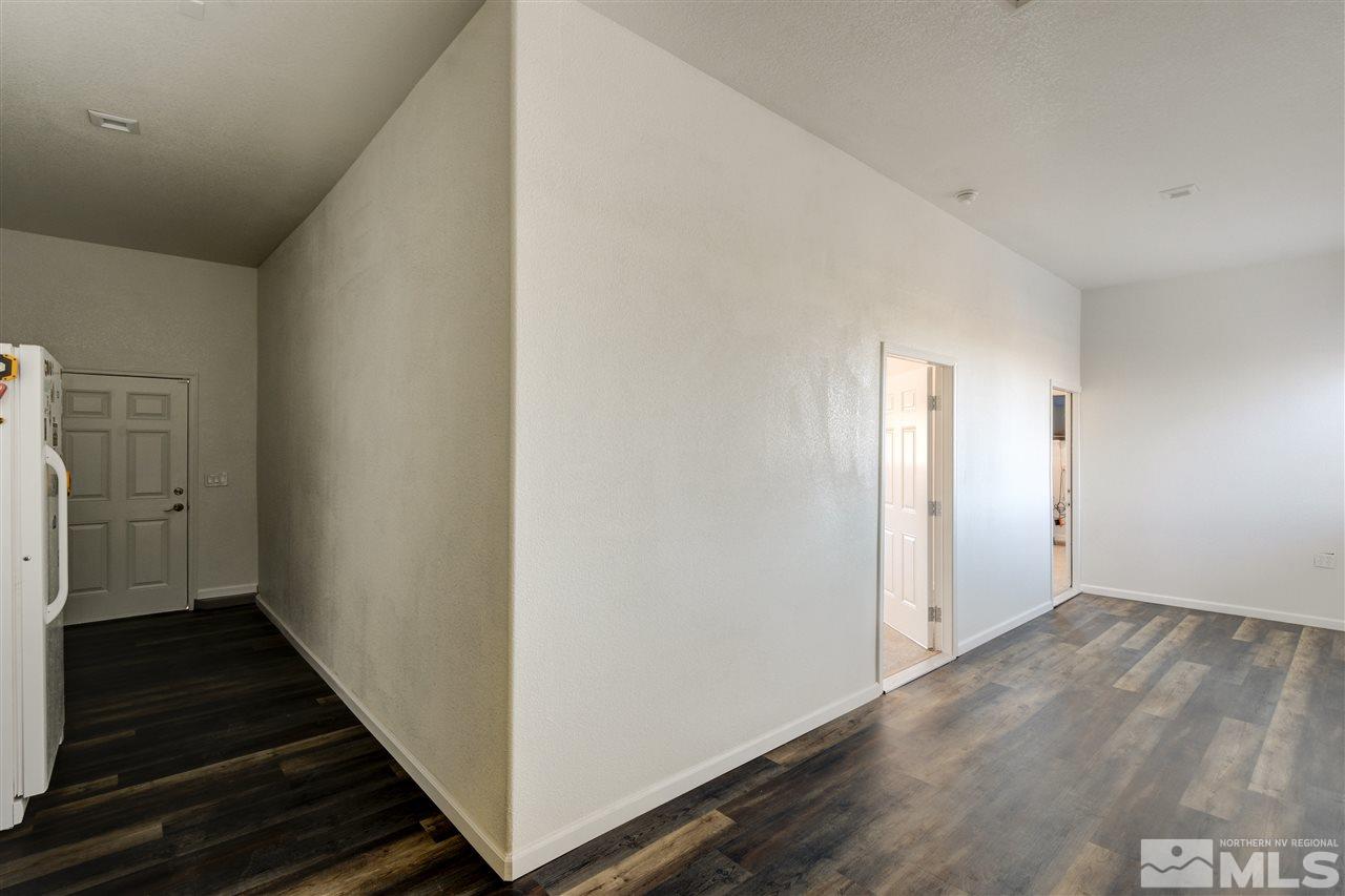 4925 Rancheria Road Fallon, NV 89406 - Photo 30 of 39 a view of a hallway with wooden floor and staircase