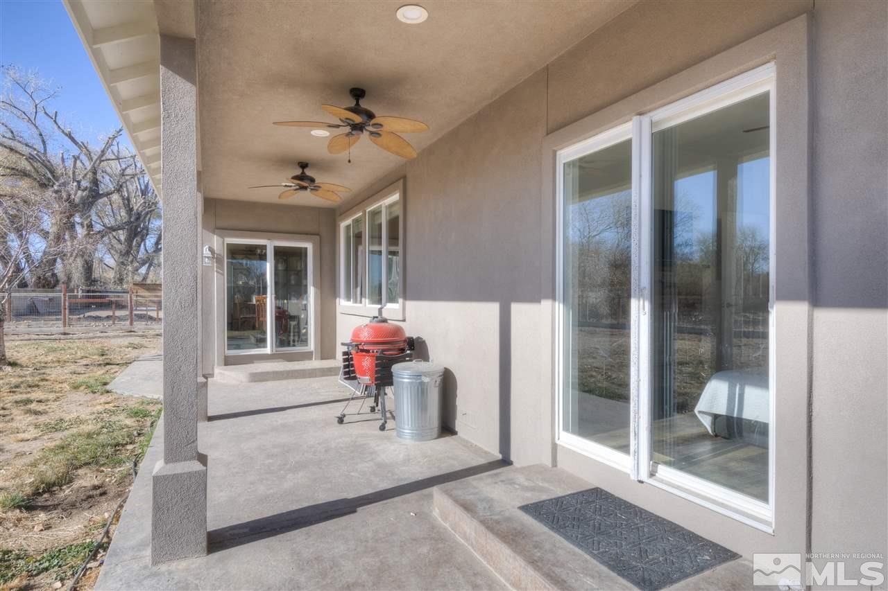 4925 Rancheria Road Fallon, NV 89406 - Photo 33 of 39 a living room filled with furniture and a glass door