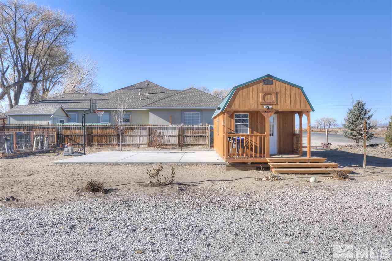 4925 Rancheria Road Fallon, NV 89406 - Photo 36 of 39 a front view of a house with a yard