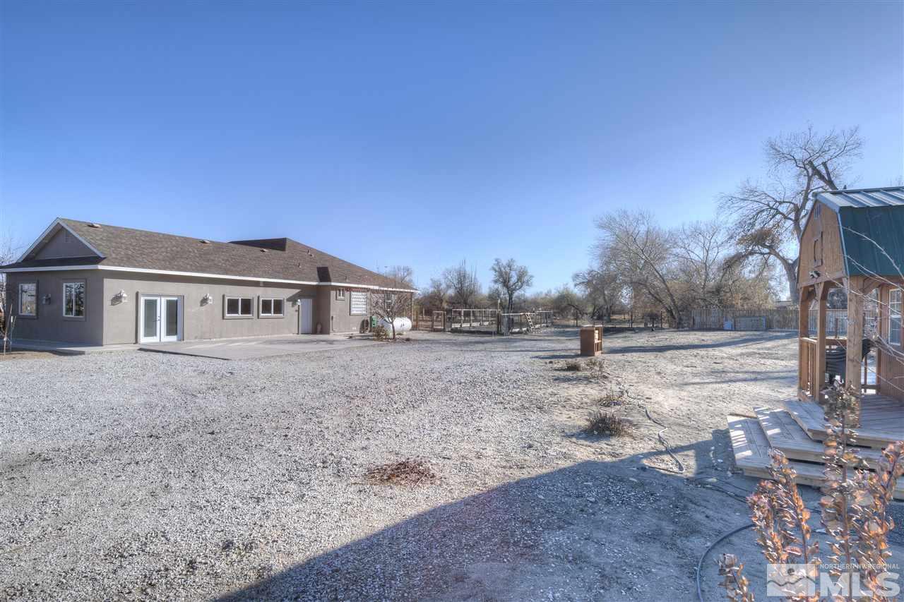 4925 Rancheria Road Fallon, NV 89406 - Photo 39 of 39 a view of a house with a yard
