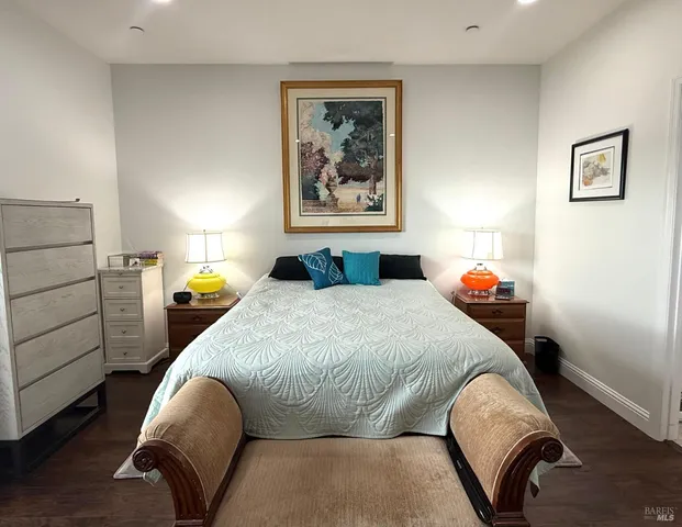 a bedroom with a bed and a television