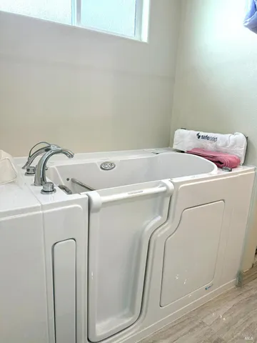 a view of a living room with wooden floor