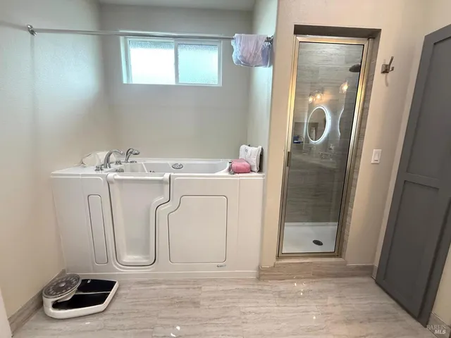 a living room with furniture and kitchen view