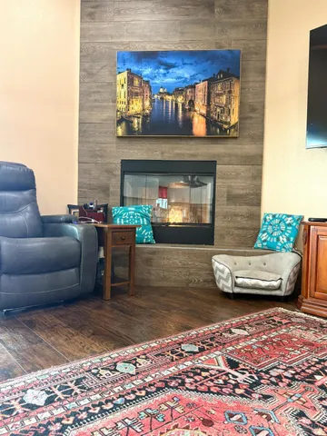 a kitchen with stainless steel appliances granite countertop a stove a sink and a white cabinets