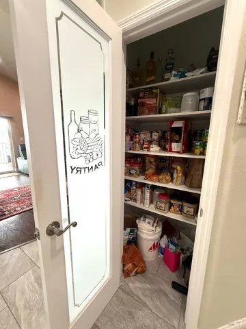 a kitchen with stainless steel appliances granite countertop a sink a stove and a wooden cabinets