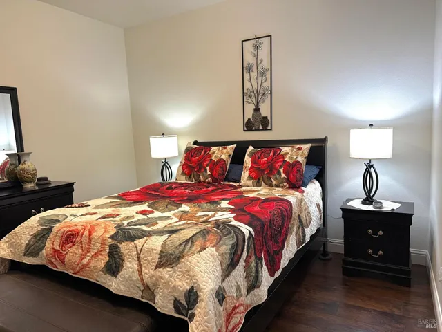 a bedroom with a bed and window