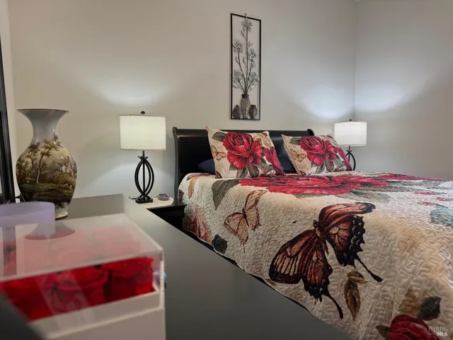 a bathroom with a granite countertop sink toilet and mirror