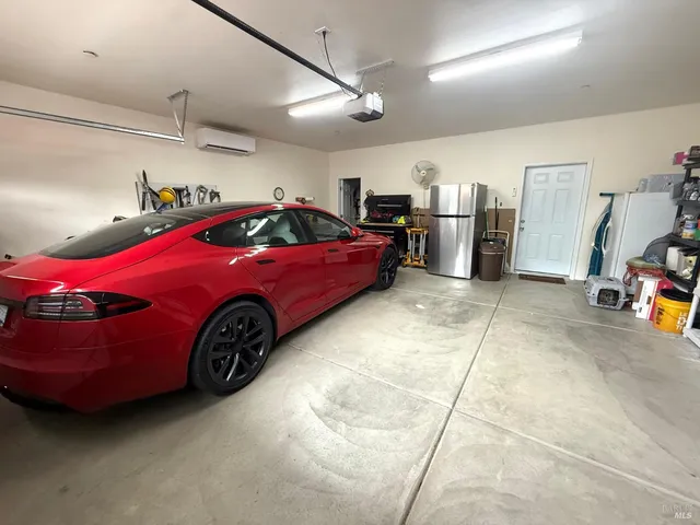 a view of a workspace with furniture and wooden floor