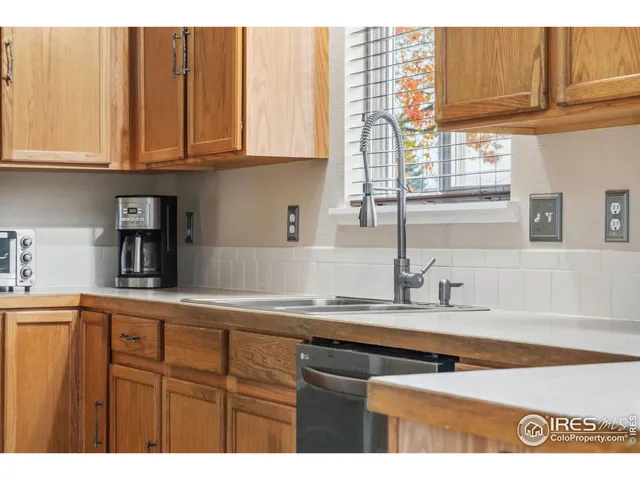 a bathroom with a tub a sink and mirror