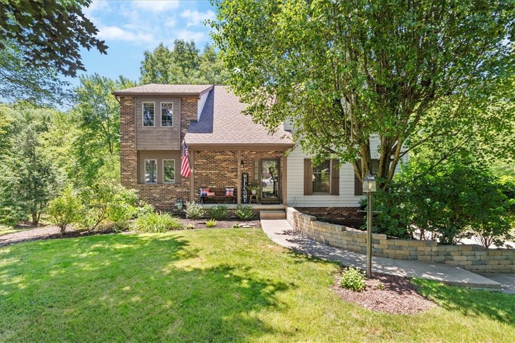 126 Firethorn Road Baden, PA 15005 - Photo 2 of 46 a front view of a house with a yard table and chairs