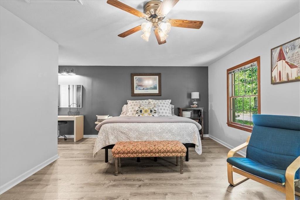 126 Firethorn Road Baden, PA 15005 - Photo 25 of 46 a spacious bedroom with a bed a couch and dresser
