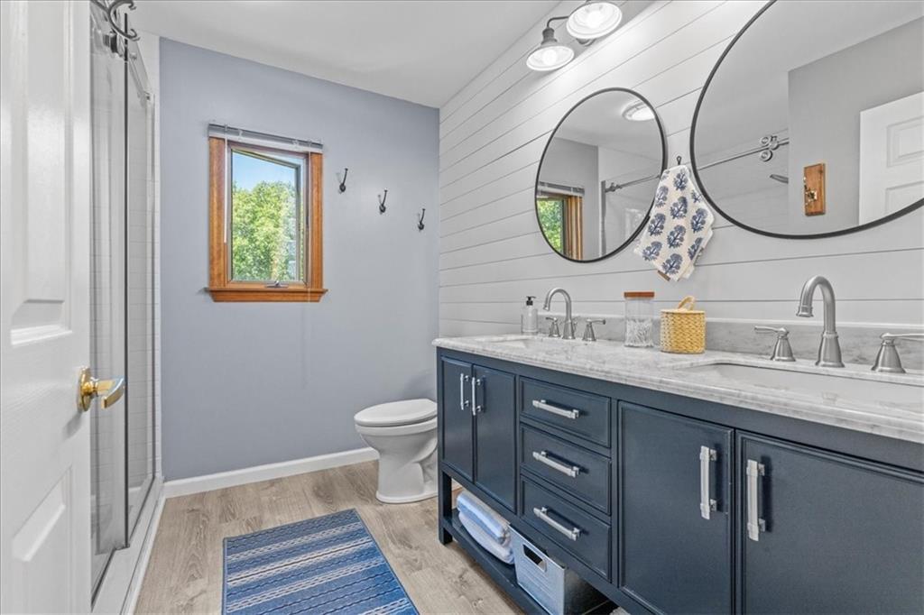 126 Firethorn Road Baden, PA 15005 - Photo 27 of 46 a bathroom with a toilet sink and mirror