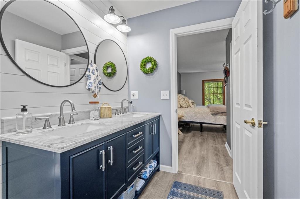 126 Firethorn Road Baden, PA 15005 - Photo 29 of 46 a bathroom with a granite countertop double vanity and a mirror