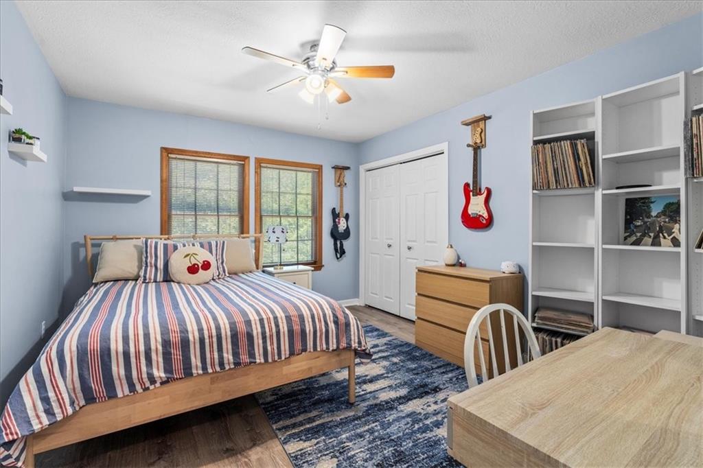 126 Firethorn Road Baden, PA 15005 - Photo 32 of 46 a bedroom with a bed and wooden floor