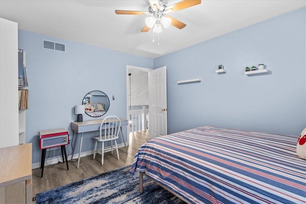 126 Firethorn Road Baden, PA 15005 - Photo 33 of 46 a bedroom with a bed and a chandelier