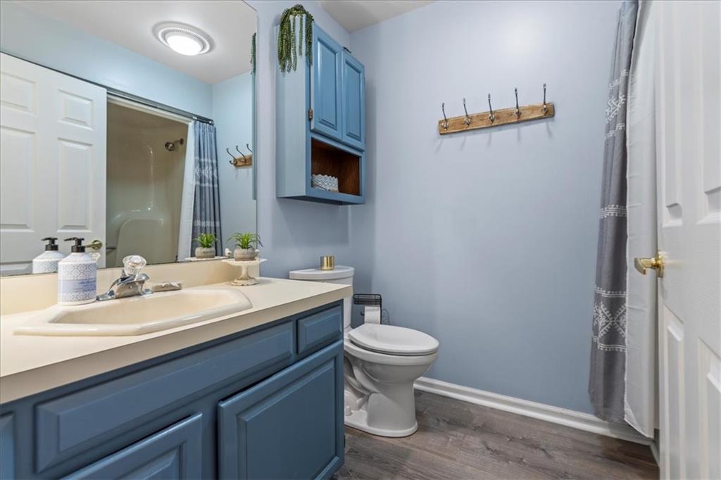 126 Firethorn Road Baden, PA 15005 - Photo 34 of 46 a bathroom with a sink a toilet and mirror