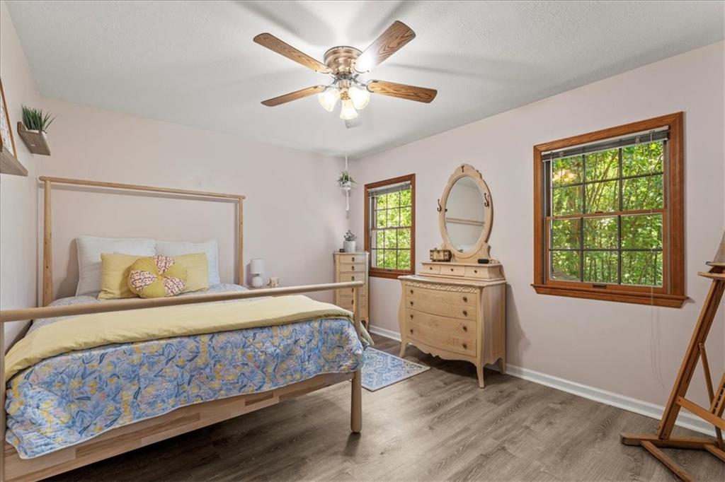 126 Firethorn Road Baden, PA 15005 - Photo 35 of 46 a bedroom with a bed and a chandelier