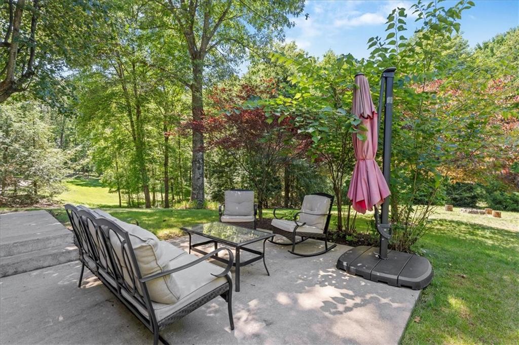 126 Firethorn Road Baden, PA 15005 - Photo 6 of 46 a view of a backyard with sitting area and furniture