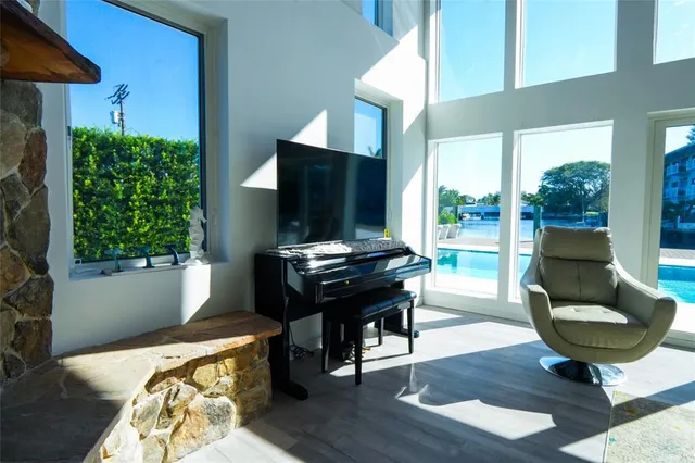 a dining room with furniture window and wooden floor
